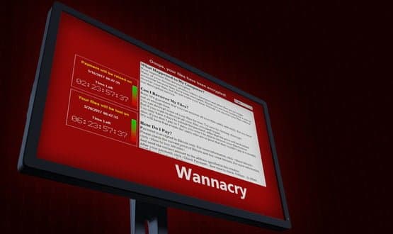 A computer screen displaying the WannaCry ransomware note